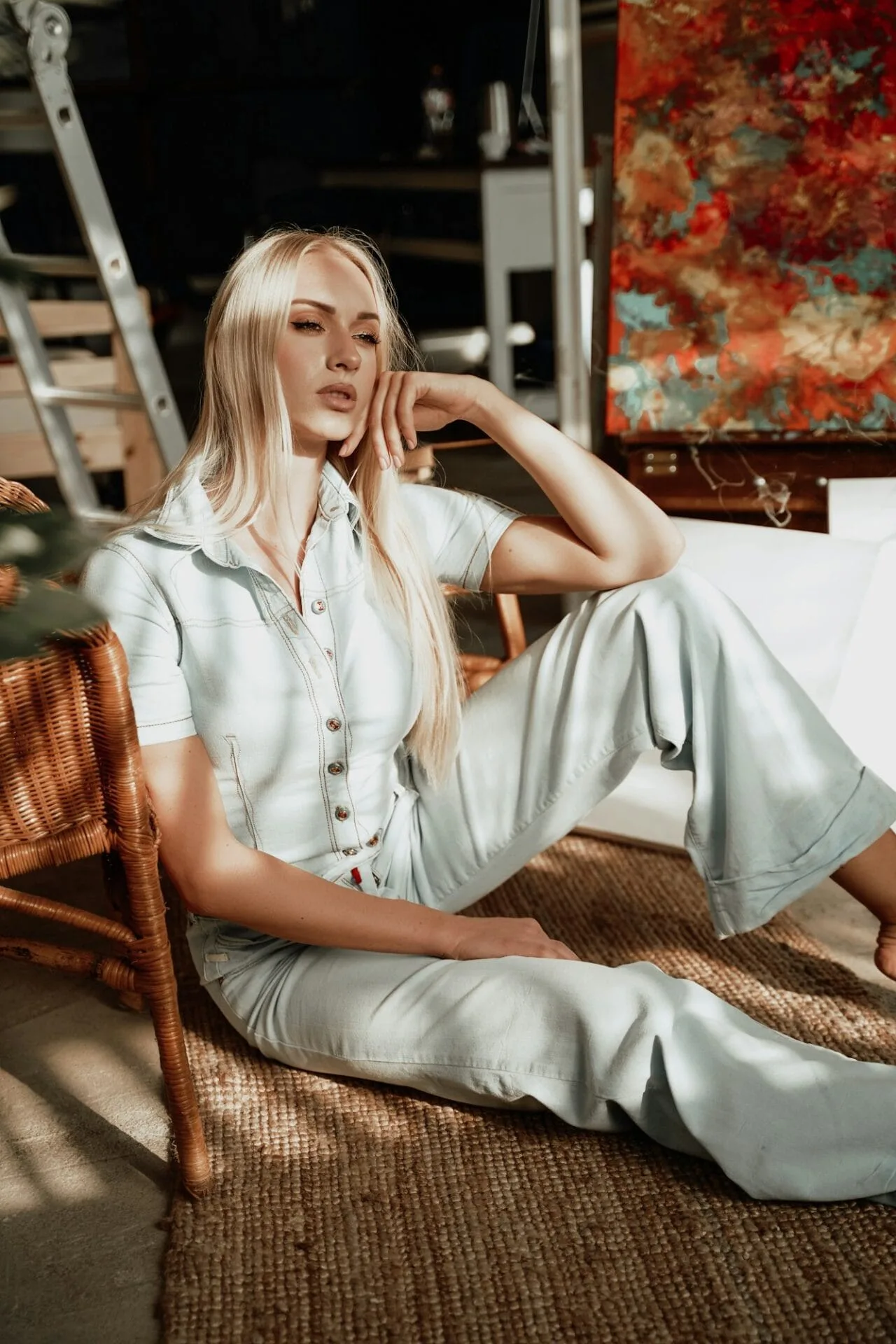Sleepy woman with blond hairs relaxing on carpet